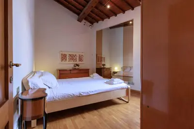 Letto o letti in una camera di Savonarola Loft
