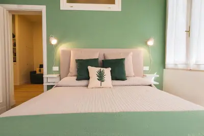 Letto o letti in una camera di Cozy olive green flat