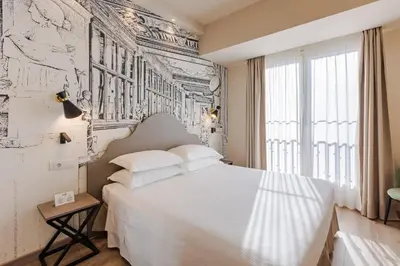 Letto o letti in una camera di FH55 Med Executive Hotel