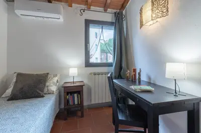 Letto o letti in una camera di Terracielo Isola, tra Parco e Centro Firenze x 5 con giardino
