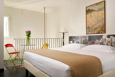 Letto o letti in una camera di Leone Blu Suites | UNA Esperienze