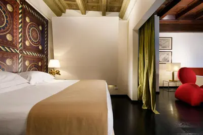 Letto o letti in una camera di Leone Blu Suites | UNA Esperienze