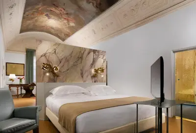 Letto o letti in una camera di Leone Blu Suites | UNA Esperienze