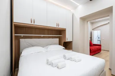 Letto o letti in una camera di 10 minuti Duomo luxury Living - Raffinatezza nel Centro Storico