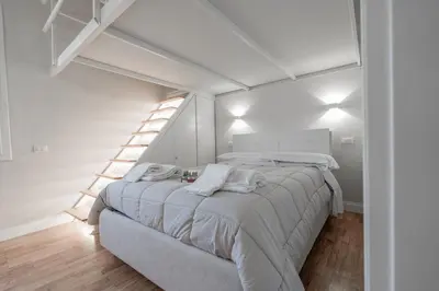 Letto o letti in una camera di CENTRO Da Vinci Loft