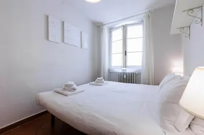 Letto o letti in una camera di Ponte Vecchio Comfort Apartment