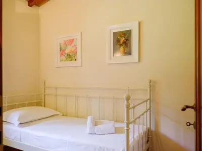 Letto o letti in una camera di Stalla - Villa with garden in the historic center