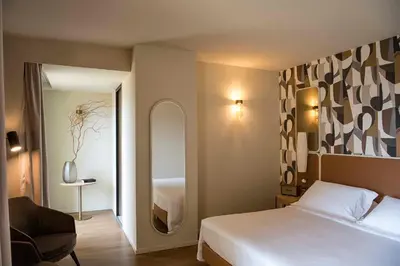 Letto o letti in una camera di Columbus Urban Resort