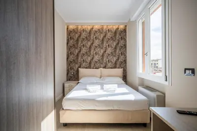 Letto o letti in una camera di 5 Minuti Stazione Luxury Firenze - Modern & Stylish Apartment