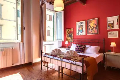 Letto o letti in una camera di Dimora Ognissanti Apartment by Mamo Florence