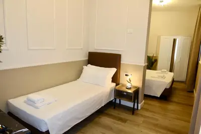Letto o letti in una camera di El Roy Garden Rooms
