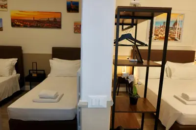 Letto o letti in una camera di El Roy Garden Rooms