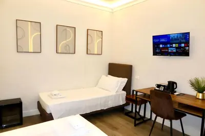 TV o dispositivi per l'intrattenimento presso El Roy Garden Rooms