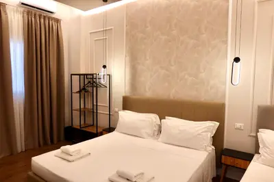 Letto o letti in una camera di El Roy Garden Rooms
