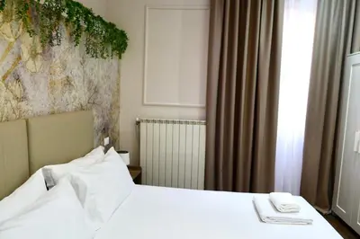 Letto o letti in una camera di El Roy Garden Rooms
