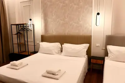 Letto o letti in una camera di El Roy Garden Rooms