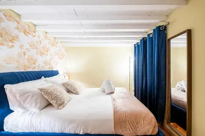 Letto o letti in una camera di Da Vinci Living Apartment a 10 minuti a piedi dal David
