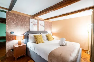 Letto o letti in una camera di Da Vinci Living Apartment a 10 minuti a piedi dal David