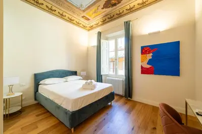 Letto o letti in una camera di Residenza d'Epoca Palazzo Salviati Quaratesi