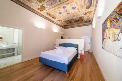 Letto o letti in una camera di Residenza d'Epoca Palazzo Salviati Quaratesi
