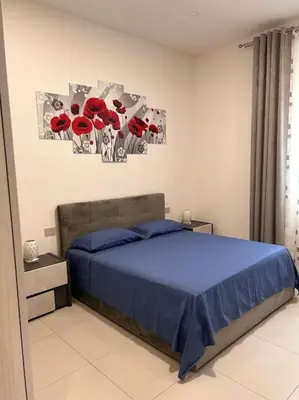 Letto o letti in una camera di Appartamento firenze