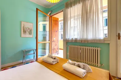 Letto o letti in una camera di Marsilio Ficino Apartment by Mamo Florence