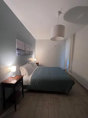 Letto o letti in una camera di San Frediano Apartment - Ampio Appartamento Deluxe per 10 Ospiti nel Cuore di Firenze