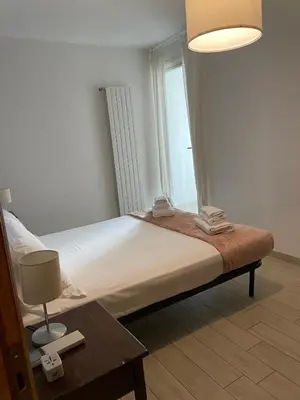 Letto o letti in una camera di San Frediano Apartment - Ampio Appartamento Deluxe per 10 Ospiti nel Cuore di Firenze