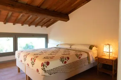 Letto o letti in una camera di Luminoso Fienile vista vigne