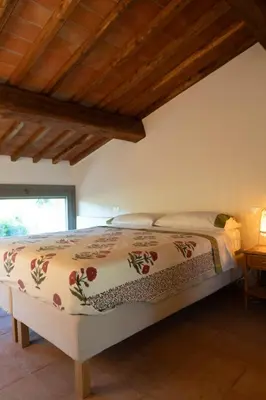 Letto o letti in una camera di Luminoso Fienile vista vigne