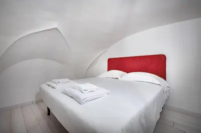 Letto o letti in una camera di YD Corte al Duomo