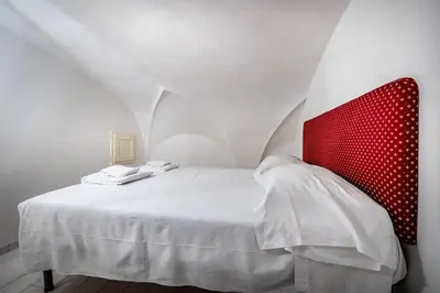 Letto o letti in una camera di YD Corte al Duomo