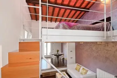 Letto o letti in una camera di Apartments Florence - San Gallo Suite VII with balcony