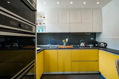 Cucina o angolo cottura di Quiet Designer Flat with Private Rooftop Terrace