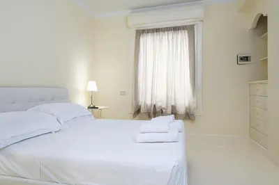 Letto o letti in una camera di UNYCA - Florence Elegant Residence