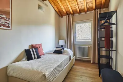 Letto o letti in una camera di Casa Camillo