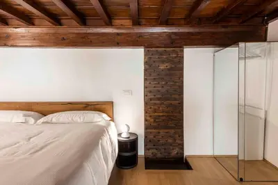 Letto o letti in una camera di appartamento palazzo bardi apartments n 1