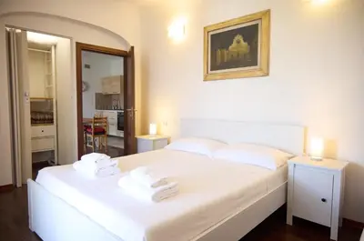 Letto o letti in una camera di Santo Spirito Terrace Apartment with a view