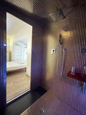 Letto o letti in una camera di L'insolita 28 by FlorenceHospitality com