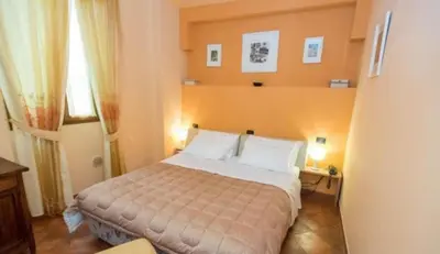 Letto o letti in una camera di Residence La Contessina
