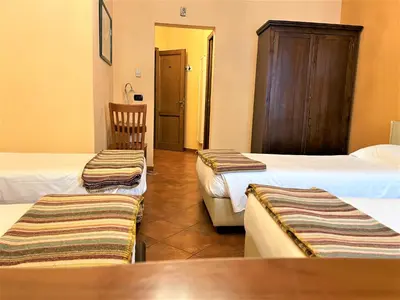 Letto o letti in una camera di Residence La Contessina