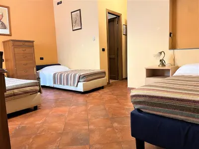 Letto o letti in una camera di Residence La Contessina
