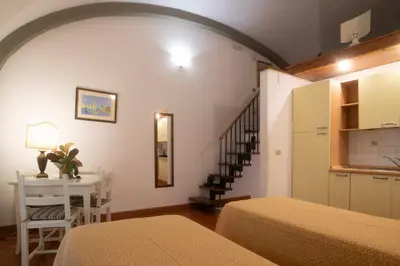 Letto o letti in una camera di Residence La Contessina