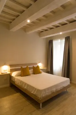 Letto o letti in una camera di La Nicchia di Niccolò