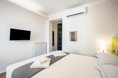 Letto o letti in una camera di GuestHost - Pisana 236 Suites