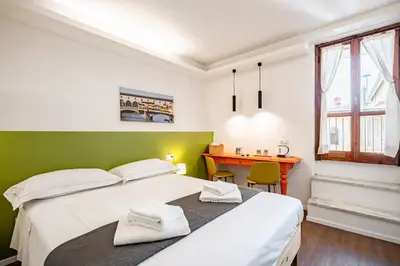 Letto o letti in una camera di GuestHost - Pisana 236 Suites
