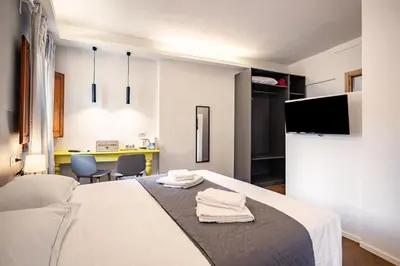 Letto o letti in una camera di GuestHost - Pisana 236 Suites