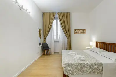 Letto o letti in una camera di GuestHost - Giardino della Fortezza Modern Apt x6 with Patio