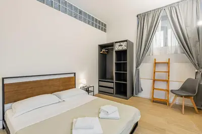 Letto o letti in una camera di GuestHost - Giardino della Fortezza Modern Apt x6 with Patio