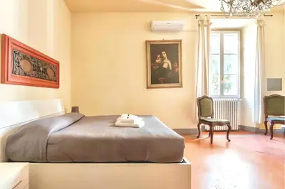 Letto o letti in una camera di The Santa Croce Palace By San Firenze Collection